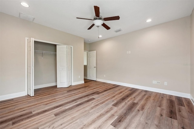 5117 Longspur Ct, Lithia, FL 33547 - unfurnished bedroom featuring wood finished floors, a closet, baseboards, recessed lighting, and ceiling fan