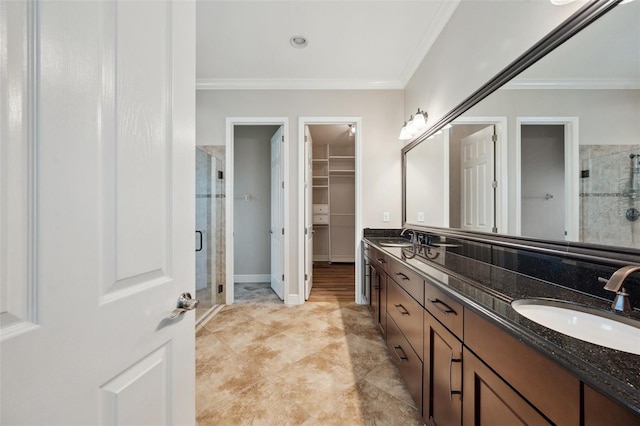 5117 Longspur Ct, Lithia, FL 33547 - bathroom featuring a stall shower, a spacious closet, crown molding, and double vanity