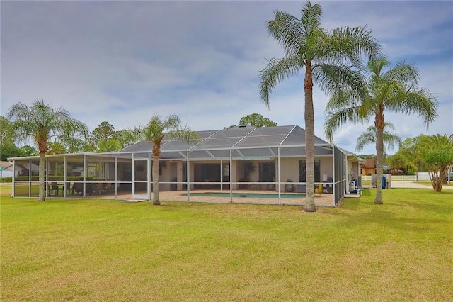 rear view of house with a lawn