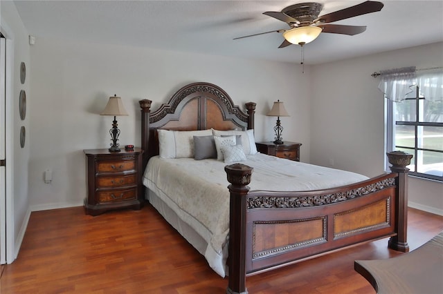 bedroom with wood finished floors, baseboards, and a ceiling fan