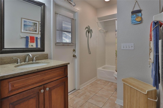 full bathroom featuring tile patterned floors, vanity, baseboards, shower / bath combination, and a textured wall