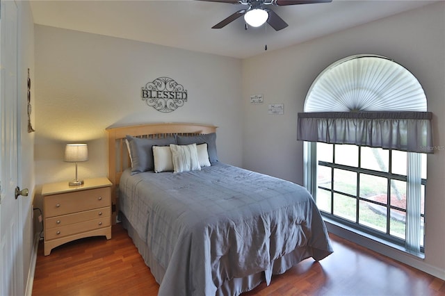 bedroom with wood finished floors and a ceiling fan