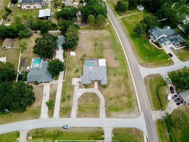 aerial view of property's location with nearby suburban area