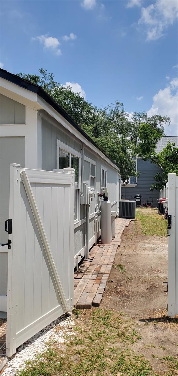 8207 Volusia Pl, Tampa, FL 33637 - view of yard featuring central air condition unit
