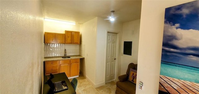 8207 Volusia Pl, Tampa, FL 33637 - bar area with a sink, backsplash, and ceiling fan