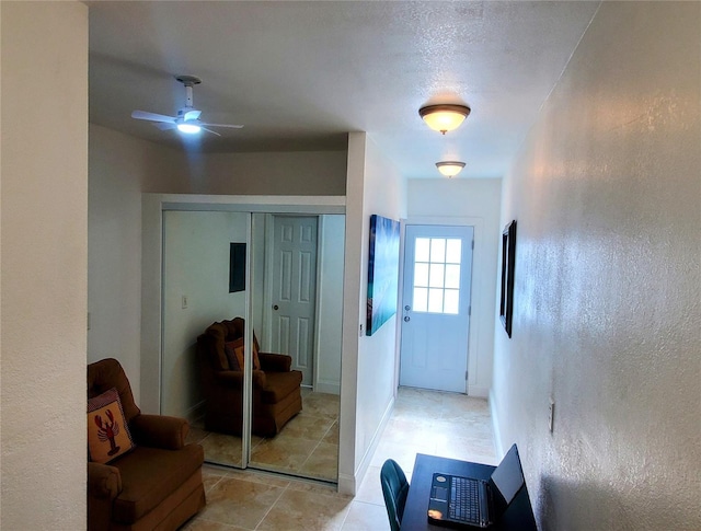 8207 Volusia Pl, Tampa, FL 33637 - hall with a textured wall and light tile patterned floors