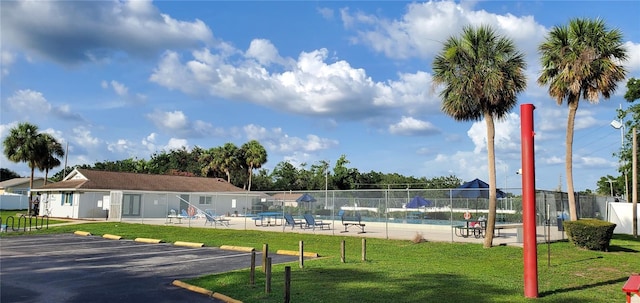 8207 Volusia Pl, Tampa, FL 33637 - view of home's community featuring uncovered parking, a pool, and a patio