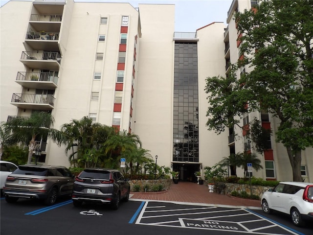2699 Seville Blvd Unit 802, Clearwater, FL 33764 - view of apartment building / complex with uncovered parking