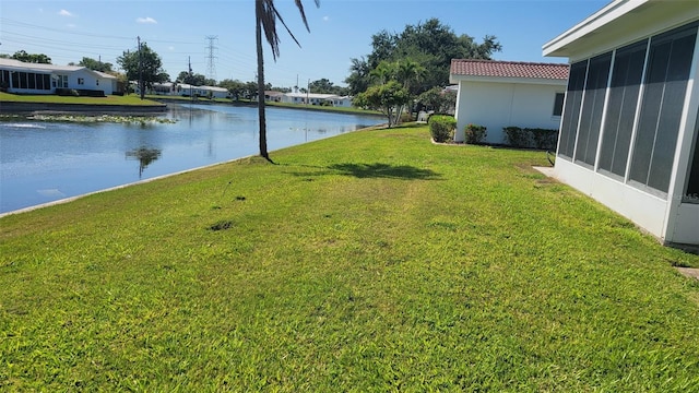 10040 38th Way N, Pinellas Park, FL 33782 - view of green lawn with a sunroom and a water view