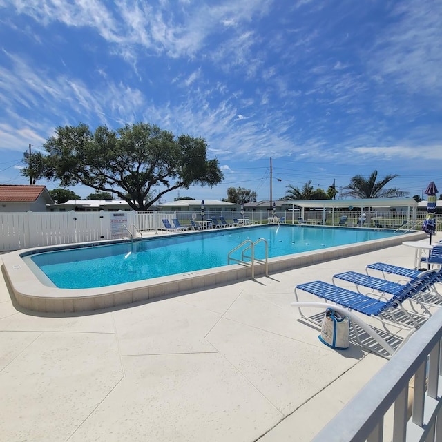 10040 38th Way N, Pinellas Park, FL 33782 - community pool featuring fence and a patio