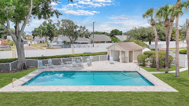 9050 Lake Place Ln, Tampa, FL 33634 - community pool featuring a residential view, an outbuilding, and a patio