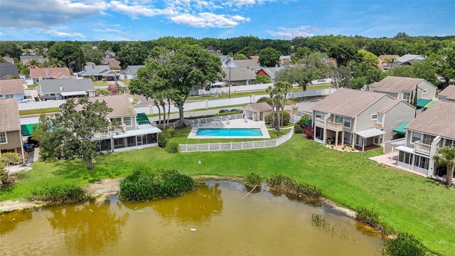 9050 Lake Place Ln, Tampa, FL 33634 - aerial view of residential area with a pool and a large body of water