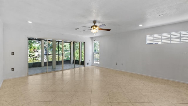 9050 Lake Place Ln, Tampa, FL 33634 - tiled empty room featuring ceiling fan, baseboards, and recessed lighting