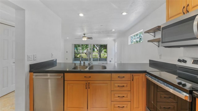 9050 Lake Place Ln, Tampa, FL 33634 - kitchen with stainless steel appliances, a sink, a peninsula, open shelves, and healthy amount of natural light