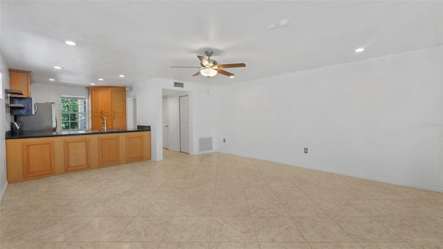 9050 Lake Place Ln, Tampa, FL 33634 - unfurnished living room with recessed lighting, a ceiling fan, and baseboards