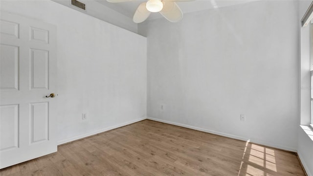 9050 Lake Place Ln, Tampa, FL 33634 - unfurnished room with wood finished floors, a ceiling fan, and baseboards