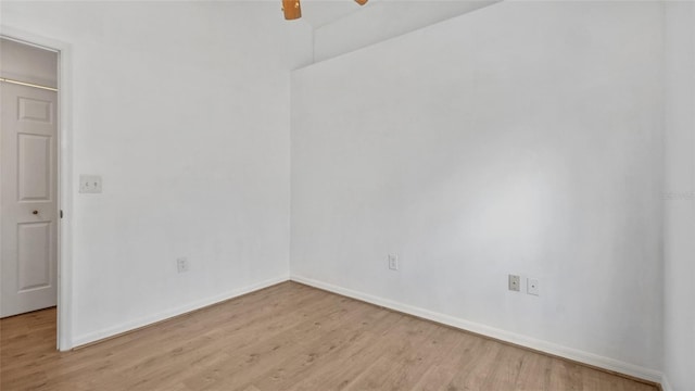 9050 Lake Place Ln, Tampa, FL 33634 - unfurnished room with light wood-style flooring, a ceiling fan, and baseboards
