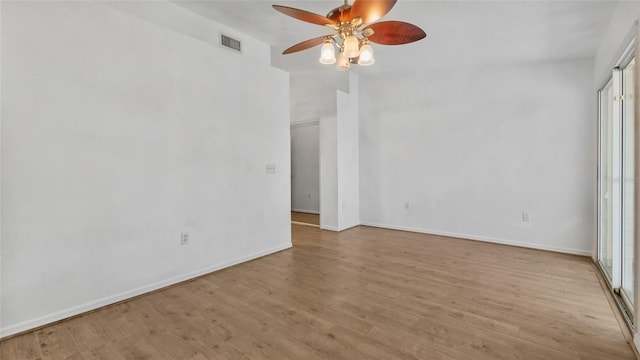 9050 Lake Place Ln, Tampa, FL 33634 - spare room with ceiling fan, wood finished floors, and baseboards