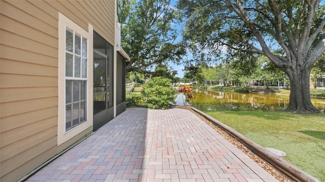 9050 Lake Place Ln, Tampa, FL 33634 - view of patio featuring a water view