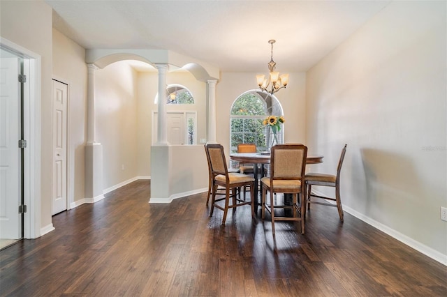 5109 Hartwell Loop, Land O Lakes, FL 34638 - dining area featuring ornate columns, wood finished floors, a chandelier, and baseboards