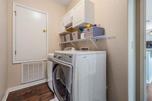 5109 Hartwell Loop, Land O Lakes, FL 34638 - laundry room featuring independent washer and dryer, wood finished floors, baseboards, and cabinet space