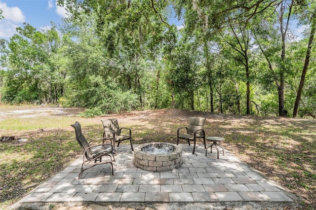 5109 Hartwell Loop, Land O Lakes, FL 34638 - view of patio with an outdoor fire pit