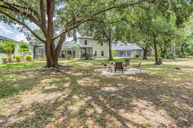 5109 Hartwell Loop, Land O Lakes, FL 34638 - view of grassy yard with a lanai and a patio area