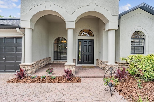 5109 Hartwell Loop, Land O Lakes, FL 34638 - doorway to property featuring stone siding and stucco siding