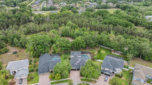 5109 Hartwell Loop, Land O Lakes, FL 34638 - aerial perspective of suburban area with a forest