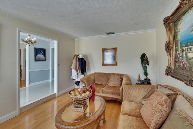 2219 Summit View Dr, Valrico, FL 33596 - living area featuring wood finished floors, a textured ceiling, ornamental molding, a chandelier, and baseboards