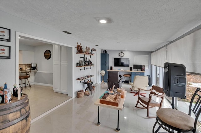 2219 Summit View Dr, Valrico, FL 33596 - living area featuring a textured ceiling and light tile patterned floors