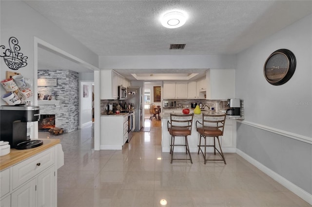 2219 Summit View Dr, Valrico, FL 33596 - dining space with a textured ceiling and baseboards