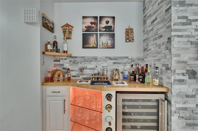 2219 Summit View Dr, Valrico, FL 33596 - indoor dry bar with beverage cooler and decorative backsplash
