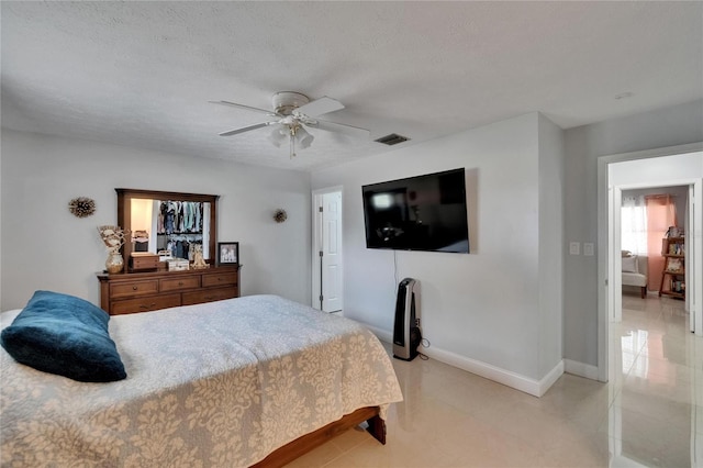 2219 Summit View Dr, Valrico, FL 33596 - bedroom with a ceiling fan and baseboards