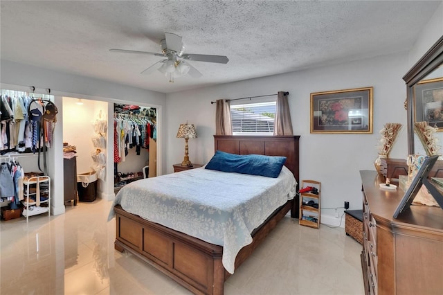 2219 Summit View Dr, Valrico, FL 33596 - bedroom featuring a textured ceiling, a closet, and ceiling fan