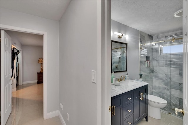 2219 Summit View Dr, Valrico, FL 33596 - full bath with a stall shower, vanity, toilet, tile patterned floors, and a textured ceiling