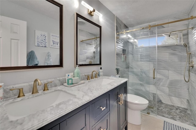 2219 Summit View Dr, Valrico, FL 33596 - bathroom with a shower stall, double vanity, toilet, and a textured ceiling