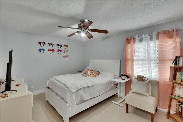 2219 Summit View Dr, Valrico, FL 33596 - bedroom with a textured ceiling and ceiling fan