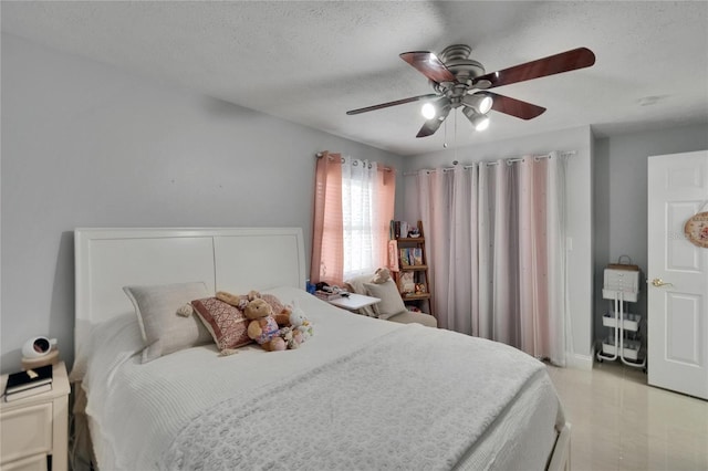 2219 Summit View Dr, Valrico, FL 33596 - bedroom featuring a textured ceiling and a ceiling fan