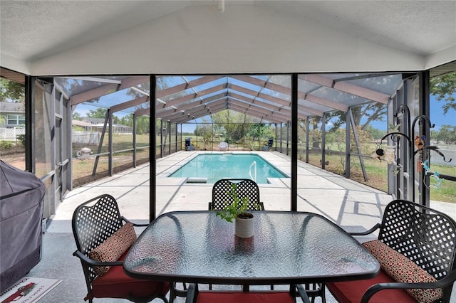 2219 Summit View Dr, Valrico, FL 33596 - view of pool featuring glass enclosure, a patio, outdoor dining space, and grilling area