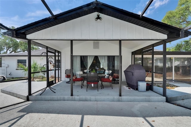 2219 Summit View Dr, Valrico, FL 33596 - view of patio featuring outdoor dining space and a lanai