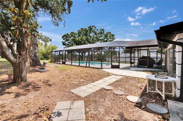 2219 Summit View Dr, Valrico, FL 33596 - view of yard featuring an outdoor pool, a patio, and a lanai