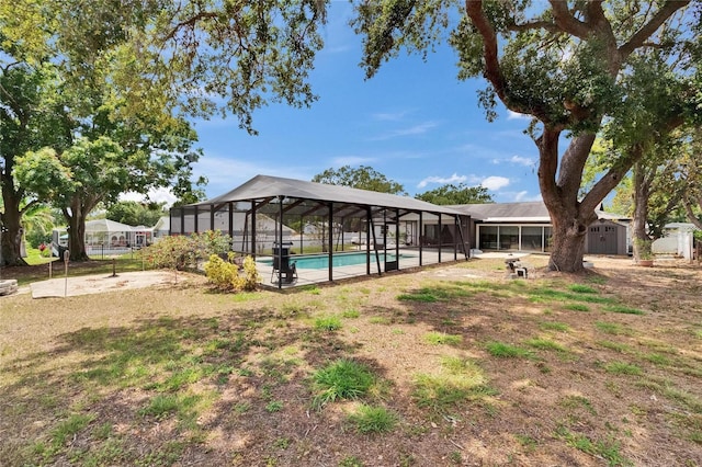 2219 Summit View Dr, Valrico, FL 33596 - outdoor pool with a storage shed, an outdoor structure, and glass enclosure
