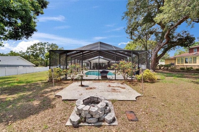 2219 Summit View Dr, Valrico, FL 33596 - view of yard with a fire pit, a patio, and glass enclosure