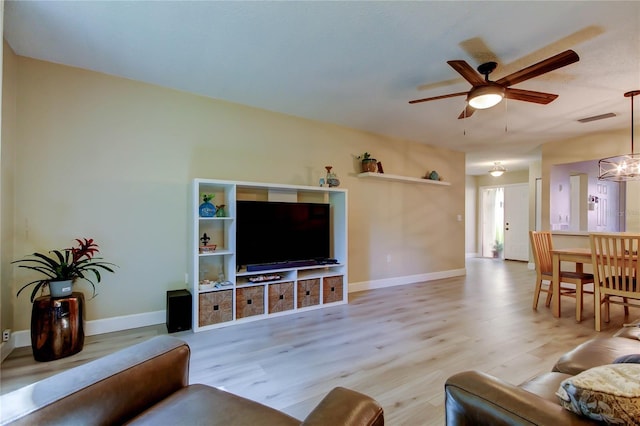 2913 Fig Ct, Palm Harbor, FL 34684 - living room with a ceiling fan, wood finished floors, and baseboards