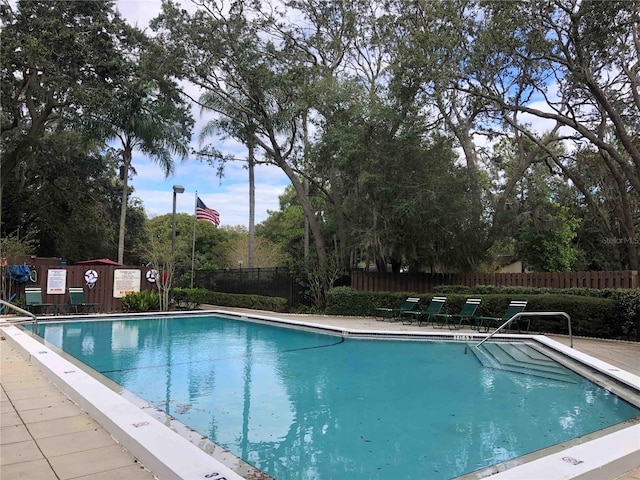 2913 Fig Ct, Palm Harbor, FL 34684 - community pool featuring fence