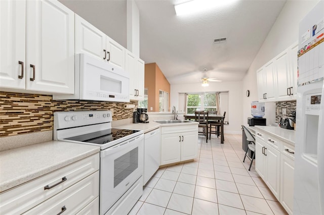 2015 W Del Webb Blvd, Sun City Center, FL 33573 - kitchen with white appliances, a sink, lofted ceiling, a ceiling fan, and light tile patterned floors