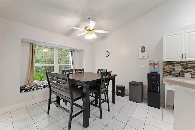 2015 W Del Webb Blvd, Sun City Center, FL 33573 - dining room with ceiling fan, light tile patterned floors, and baseboards