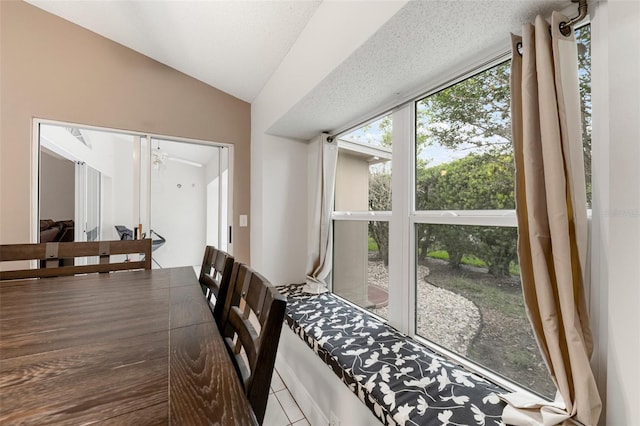 2015 W Del Webb Blvd, Sun City Center, FL 33573 - dining area featuring lofted ceiling and tile patterned flooring