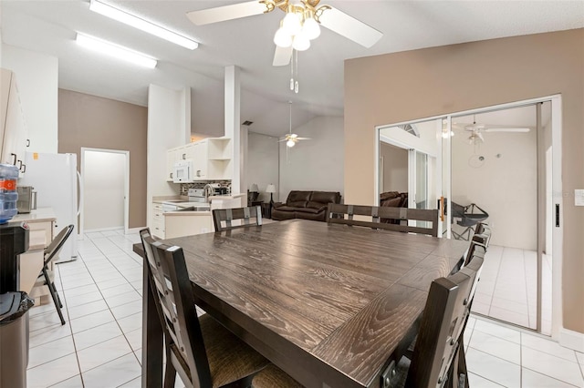 2015 W Del Webb Blvd, Sun City Center, FL 33573 - dining area featuring ceiling fan, light tile patterned floors, and lofted ceiling
